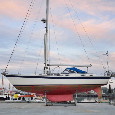 45 ft cruising sailboat standing on land in a yacht marina. Transportation, nautical vessel, repair and service, sailing, sport, recreation. tourism, leisure activity concepts
