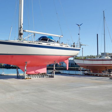 45 ft cruising sailboat standing on land in a yacht marina. Transportation, nautical vessel, repair and service, sailing, sport, recreation. tourism, leisure activity concepts