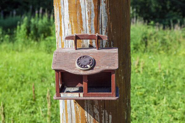 Bird feeder in the form of a telephone. Reserve "Kivach". Republic of Karelia. Russia. 12 July 2021