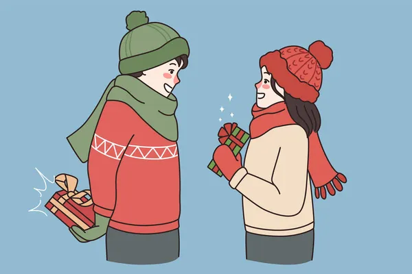 Gelukkig jongen en meisje ruilen cadeautjes voor Valentijnsdag — Stockvector