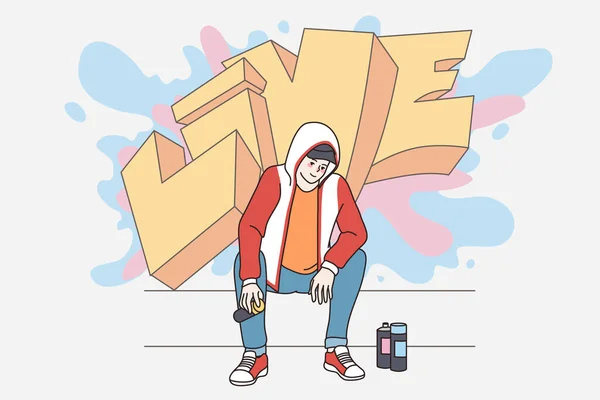 Mutlu bir milenyum adamı sokak duvarına grafiti çiziyor. — Stok Vektör