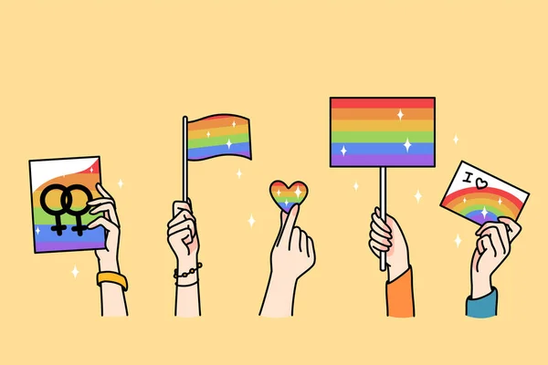 Manos de personas sostienen banderas LGBT — Vector de stock