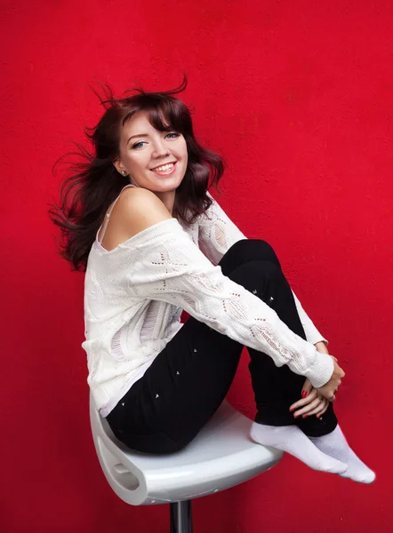 Beautiful smiling girl sitting on the chair — Stock Photo, Image