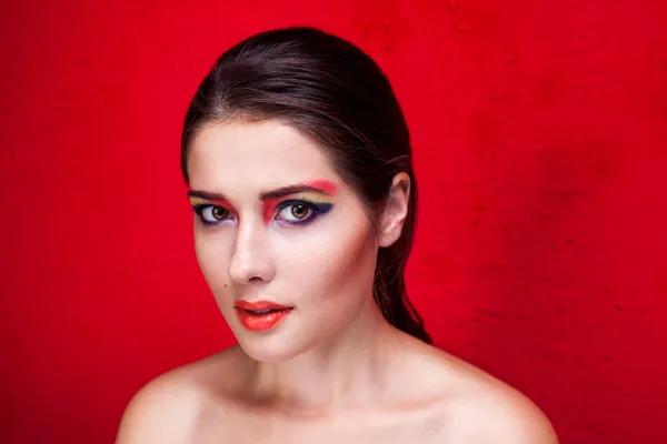 Beauty makeup portrait on red background — Stock Photo, Image