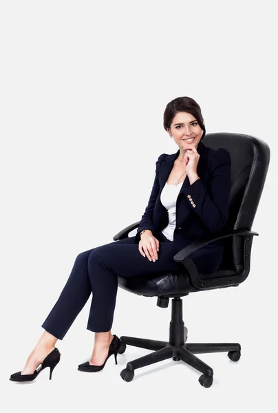 Obchodní žena sedí v kanceláři Stock Fotografie