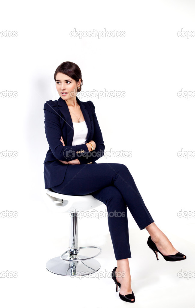 Happy successful business woman in office chair on white background