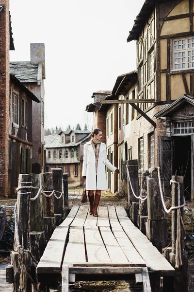 Fashion portrait of beautiful woman in old vintage street — Stock Photo, Image