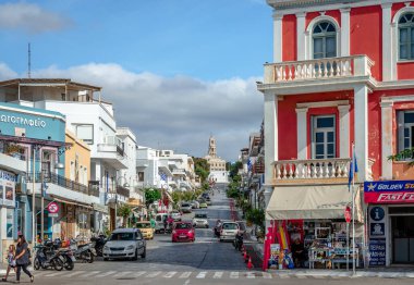 Tinos, Greece - October 18 2020: View of the marble paved Megaloharis Avenue that leads to the building complex of the Church of the Assumption, aka Our Lady Of Tinos.