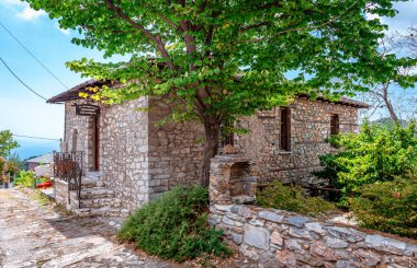 Vizitsa, Greece - August 17 2020: Old stone mansion in Vizitsa, a small traditional village on the Mount Pelion, Thessaly, Greece.