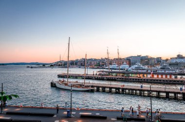 Oslo, Norway - August 13 2022: View of the harbor and the city in the dusk. Long exposure capture from Akershus Fortress. 