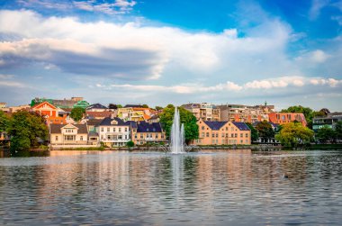 View of Lake Breiavatnet in Stavanger, Norway, on a summer afternoon.