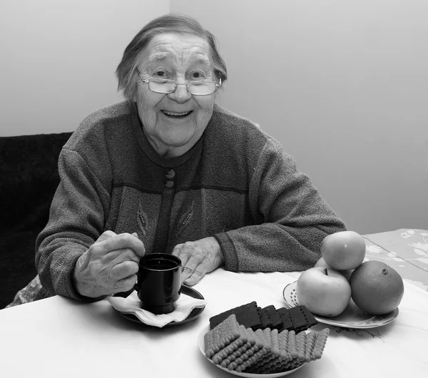 Elderly grandmother at a tea party — Stock Photo, Image