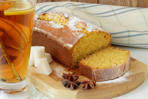 Sponge cake made from corn flour and a cup of tea — Stock Photo, Image