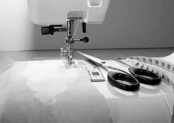 Sewing machine, scissors and tape — Stock Photo, Image