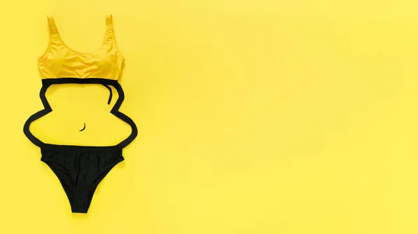 Summer Women Bikini swimsuit, female swimwear with Excess weight, Obesity body silhouette on color yellow background. Overweight and obesity Weight loss Creative concept. Long web banner copy space