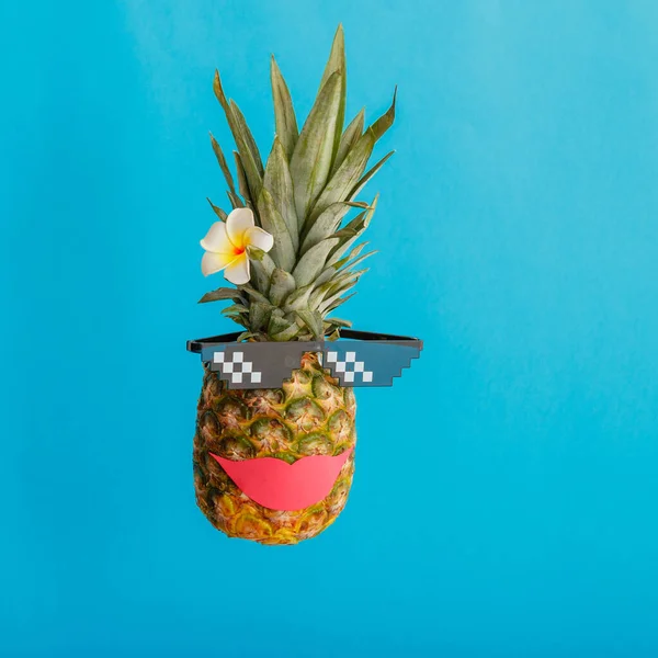 Funny pineapple female face with smile red lips sunglasses plumeria flower. Tropical summer fruits levitating creative summer pineapple on color blue summer background. square portrait — Foto de Stock