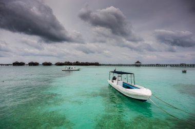 Boats and Resort at Mabul Island clipart