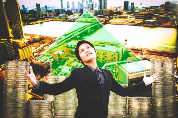 Happy smiling young businessman wearing black suit concept of success,Working successful, leadership and victory in business. background the city