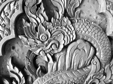 Pattern art processing of sculpture image carvings on wood background. Thai style carved wooden door detail, Close up,black and white