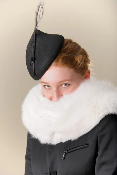 Redhead in black hat and white fur — Stock Photo, Image