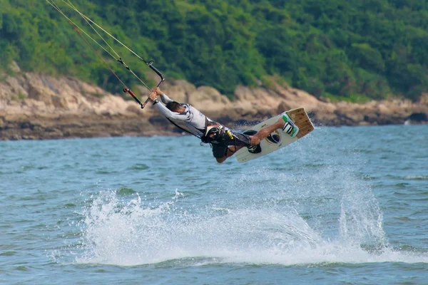 Male kite surfer horizontal in big jump — Stock Photo, Image