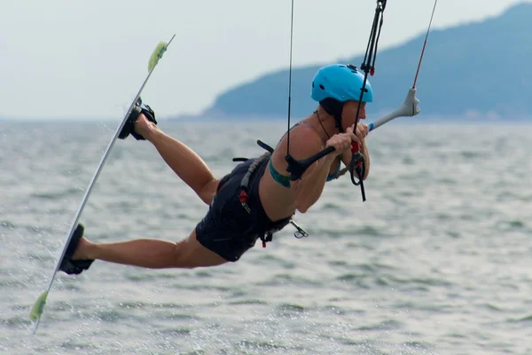 Close-up of female kite surfer while jumping — Stock Photo, Image
