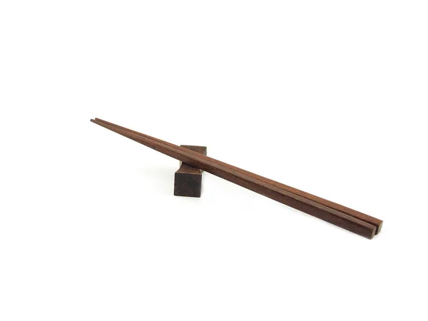 箸に茶色の木製の箸の残りの部分を隔離した 家庭やレストラン 食品のデザインのために使用します キッチンアクセサリー — ストック写真