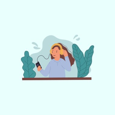 Kulaklık takan ve müzik dinleyen genç kız.