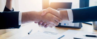 Success and teamwork cooperate concept, two business man shake hand after successful agreement, handshake of partnership team and success of deal and contract 