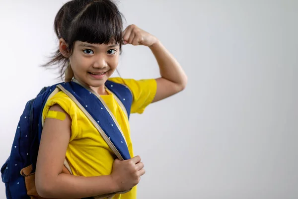 Asian Young Girl Showing Her Arm Yellow Bandage Got Vaccinated — Zdjęcie stockowe