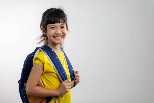Asian Young Girl Showing Her Arm Yellow Bandage Got Vaccinated — стокове фото
