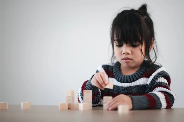 Cheerful Asian Girl Playing Wooden Building Blocks Having Fun Learning — Zdjęcie stockowe