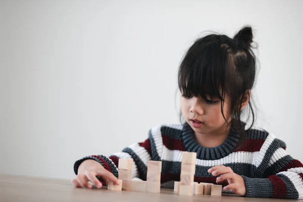 Cheerful Asian Girl Playing Wooden Building Blocks Having Fun Learning — Zdjęcie stockowe