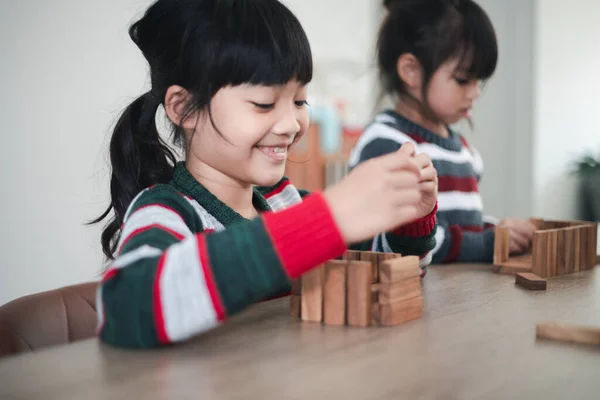 Cheerful Asian Girl Playing Wooden Building Blocks Having Fun Learning — Stockfoto