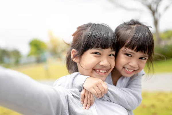 Happy Asian Child Takes Selfie Park Photo De Stock