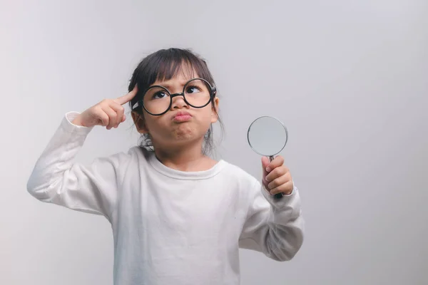 Little Girl Child Holding Magnifying Glass White Background — Stockfoto