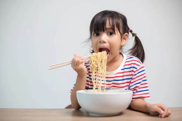 Cute Asian Child Girl Eating Delicious Instant Noodles Home — 스톡 사진