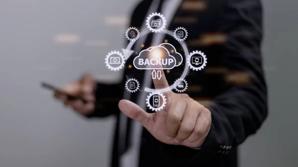 Backup files and data on internet with cloud storage technology that sync all online devices and computers with network connection, protection against loss, business person touch screen icon concept