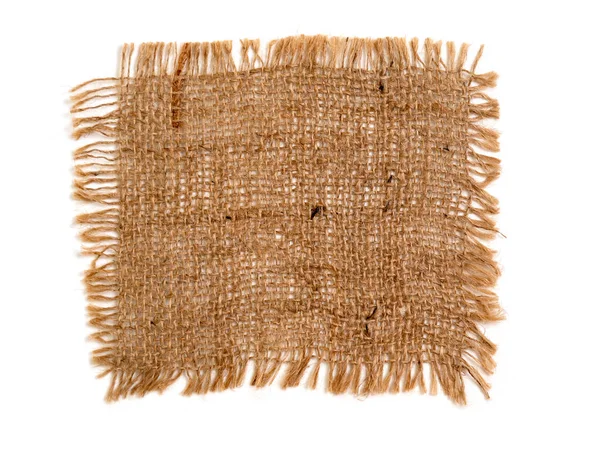 装飾的なナプキン 生地のサンプルは 糸の粗い強い厚い織りからのバラップです ストック画像