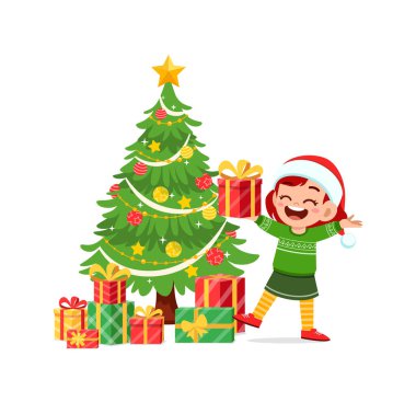 Mutlu küçük kız Noel hediyesini tutuyor.
