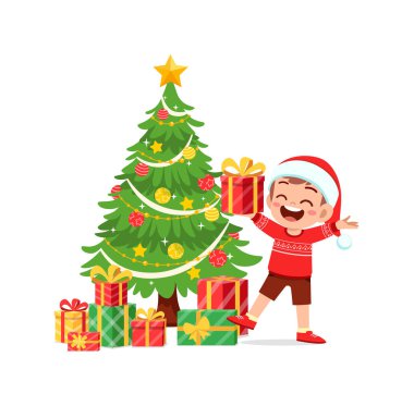 Mutlu küçük çocuk Noel hediyesini tutuyor.