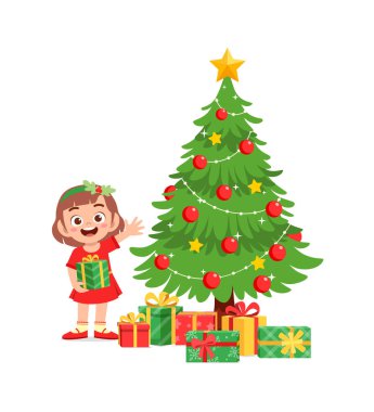 Mutlu küçük kız Noel hediyesini tutuyor.