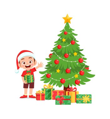 Mutlu küçük çocuk Noel hediyesini tutuyor.