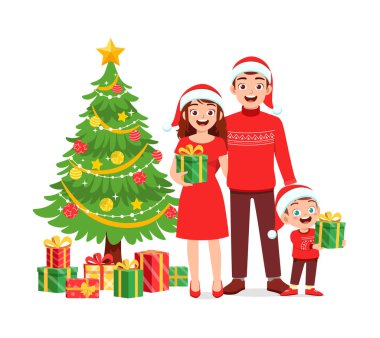 Mutlu anne ve baba ve çocuk Noel 'i kutluyor.