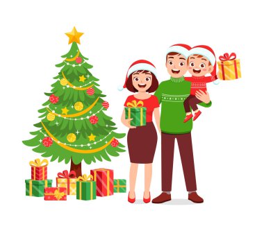 Mutlu anne ve baba ve çocuk Noel 'i kutluyor.