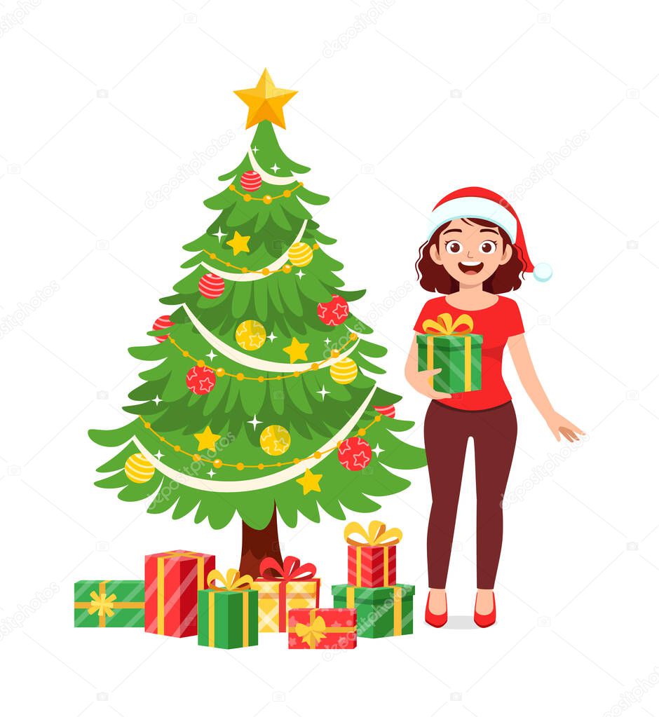 young woman holding box present in christmas