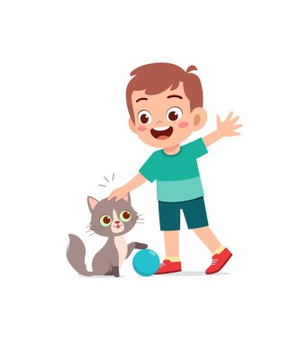 Küçük çocuk sevimli kediyle oynuyor.