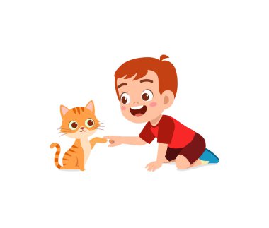 Küçük çocuk sevimli kediyle oynuyor.