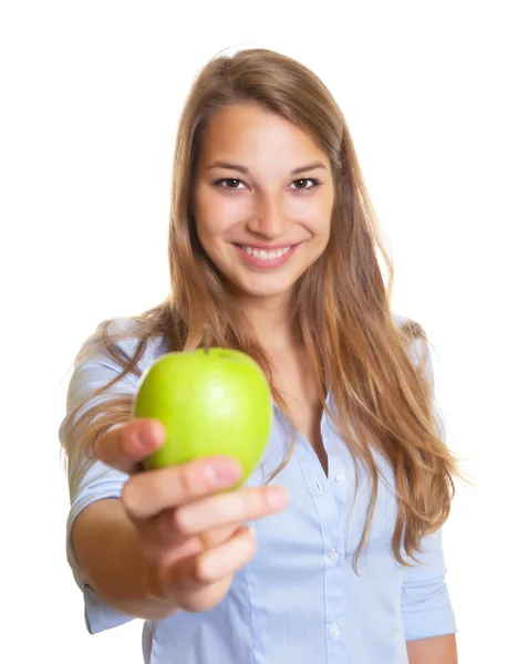 Beautiful woman offers an apple — Stock Photo, Image