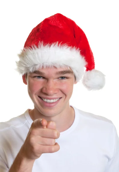 Pointing guy with christmas hat — Stock Photo, Image